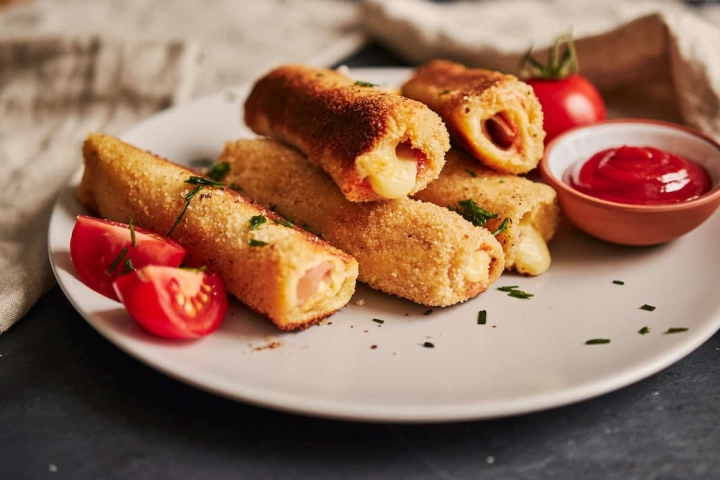 Almuerzo escolar: Prepara rollitos de jamón con queso empanizados