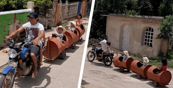 Papá construye un tren con barriles para sus niños.