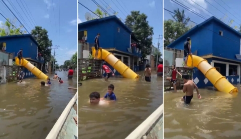 Colocan tobogán en calle inundada de Tampico y niños convierten el desastre en juego