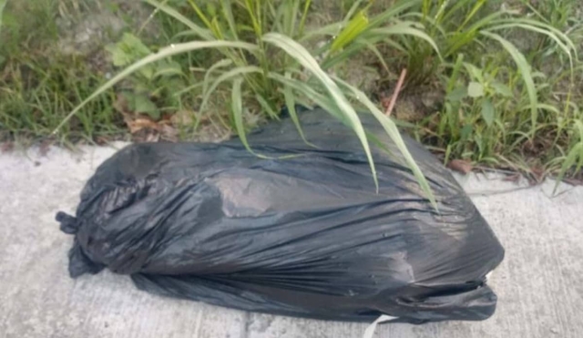 Abandonan un cadáver dentro de una bolsa