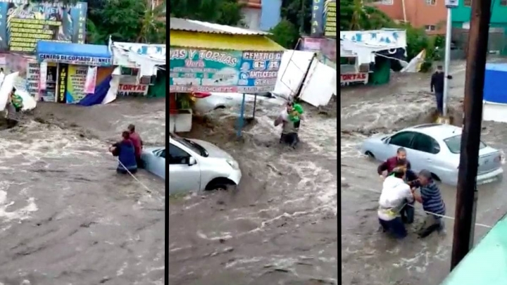 Salvan a bebé de las inundaciones en Ecatepec.